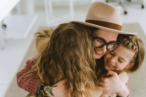 mother with glasses with her children