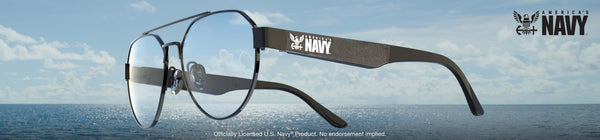 Glasses with a 'Navy' logo on the frame against a blue sky and ocean background